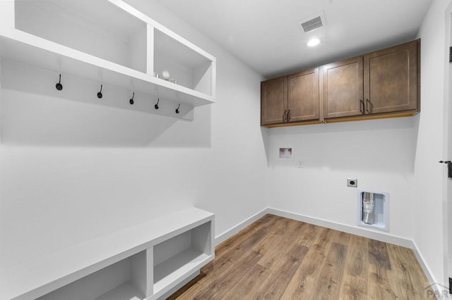 washroom with heating unit, visible vents, baseboards, electric dryer hookup, and washer hookup