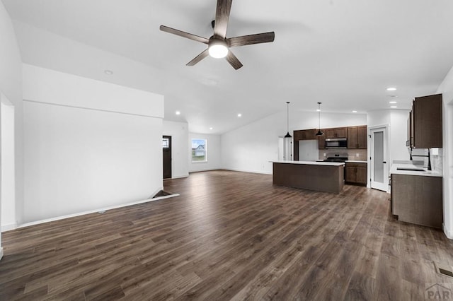 unfurnished living room with recessed lighting, lofted ceiling, a ceiling fan, and dark wood-style floors