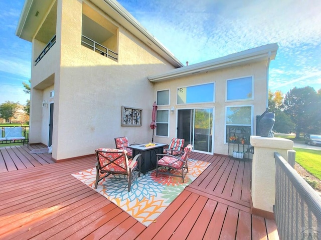 wooden deck featuring outdoor lounge area