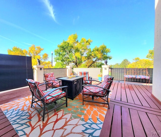 deck with an outdoor fire pit