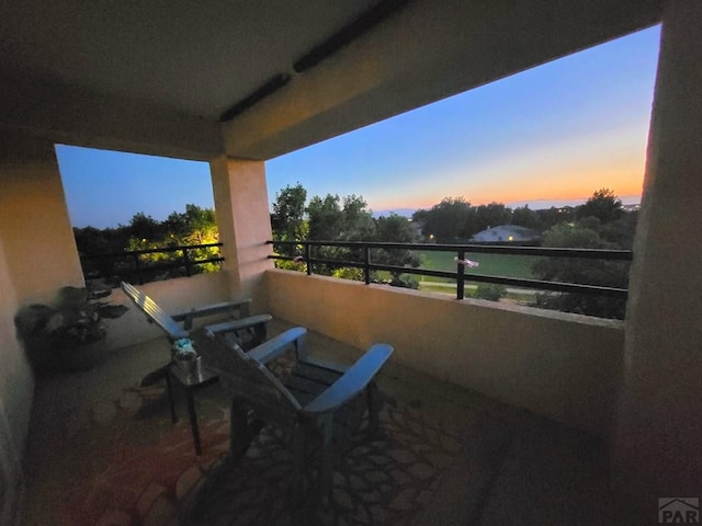 patio terrace at dusk with a balcony