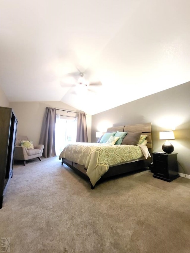 carpeted bedroom featuring lofted ceiling and a ceiling fan