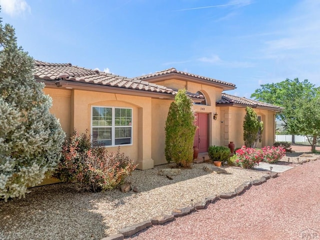 348 S Tejon Ln, Pueblo West, CO 81007 - mediterranean / spanish house featuring stucco siding and a tile roof