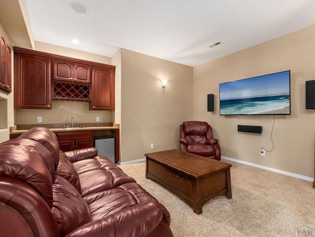 348 S Tejon Ln, Pueblo West, CO 81007 - living room featuring wet bar, light colored carpet, and recessed lighting
