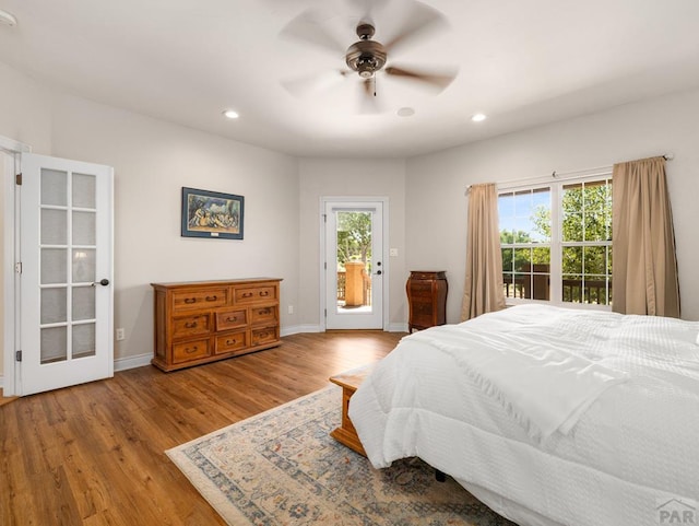 348 S Tejon Ln, Pueblo West, CO 81007 - bedroom with access to outside, multiple windows, wood finished floors, recessed lighting, and a ceiling fan