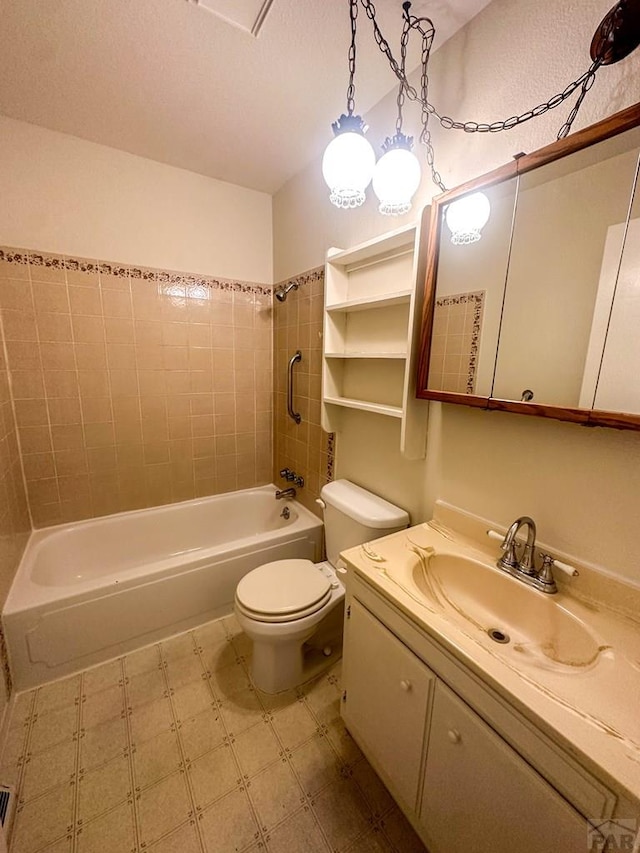 full bath with a textured ceiling, toilet, tile patterned floors, vanity, and shower / bathtub combination