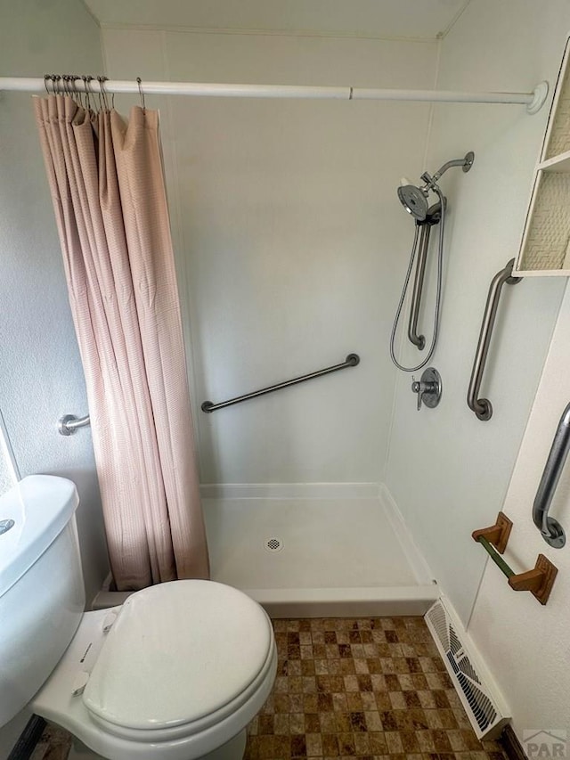bathroom with tile patterned floors, visible vents, toilet, and a shower with shower curtain