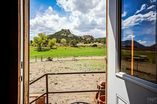 entryway featuring a rural view and a mountain view
