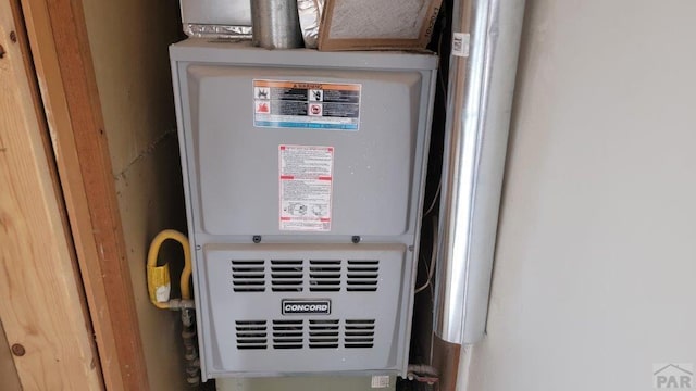 utility room with heating unit