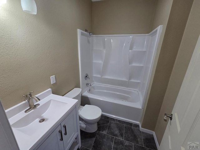 full bath featuring shower / bathtub combination, a textured wall, toilet, vanity, and tile patterned floors