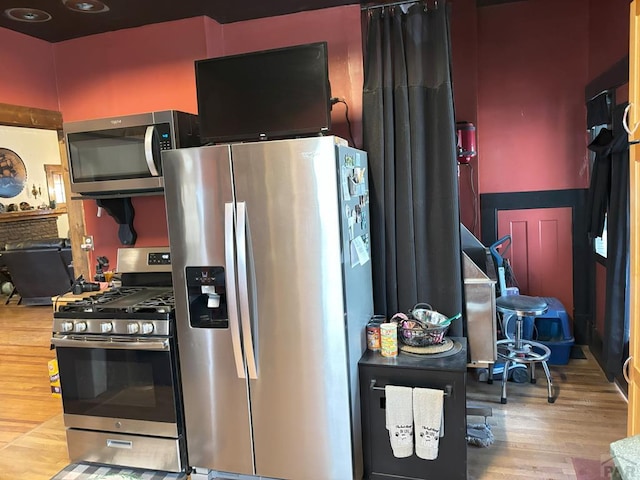 kitchen featuring wood finished floors and stainless steel appliances
