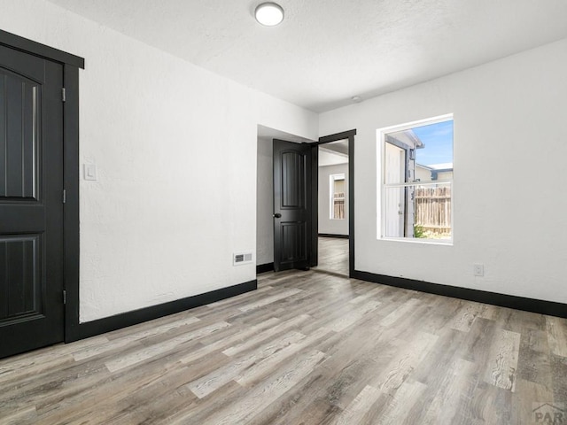 2803 Baltimore Ave, Pueblo, CO 81008 - empty room featuring light wood-style flooring and baseboards