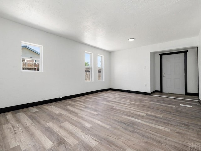 2803 Baltimore Ave, Pueblo, CO 81008 - empty room featuring wood finished floors and a textured ceiling