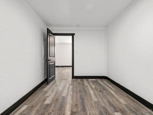 2803 Baltimore Ave, Pueblo, CO 81008 - unfurnished room with wood finished floors and a textured wall