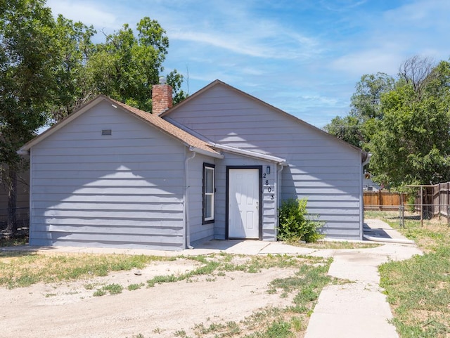 2803 Baltimore Ave, Pueblo, CO 81008 - view of front facade with a chimney