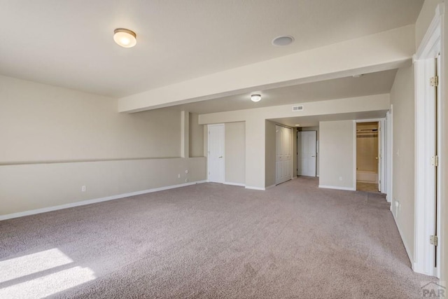 1447 Madison Ridge Hts Unit E, Colorado Springs, CO 80904 - unfurnished bedroom featuring carpet floors, baseboards, and two closets