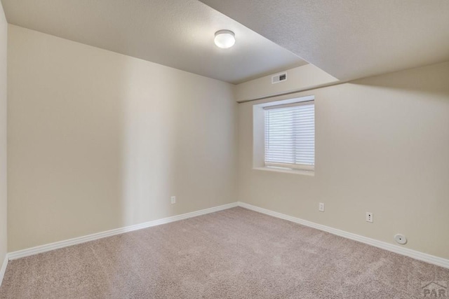 1447 Madison Ridge Hts Unit E, Colorado Springs, CO 80904 - spare room with carpet and baseboards