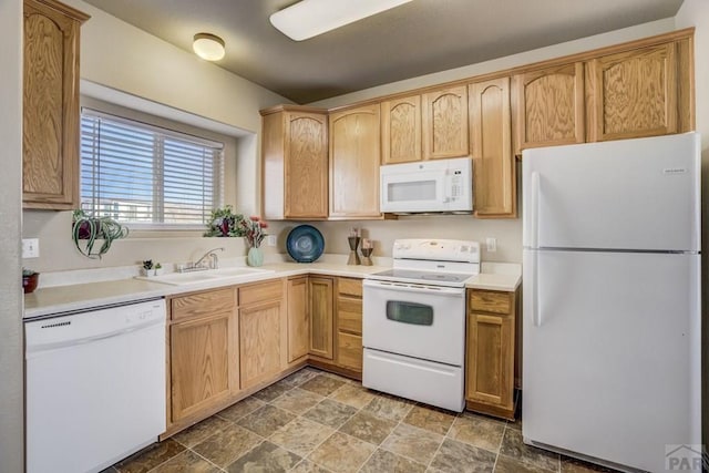 1447 Madison Ridge Hts Unit E, Colorado Springs, CO 80904 - kitchen featuring white appliances, a sink, stone finish flooring, light countertops, and light brown cabinetry