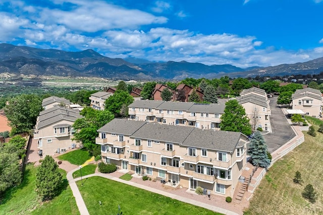 1447 Madison Ridge Hts Unit E, Colorado Springs, CO 80904 - drone / aerial view of a mountainous background