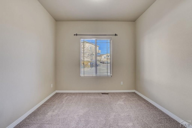1447 Madison Ridge Hts Unit E, Colorado Springs, CO 80904 - unfurnished room featuring carpet and baseboards