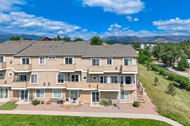 1447 Madison Ridge Hts Unit E, Colorado Springs, CO 80904 - view of building exterior with a mountain view