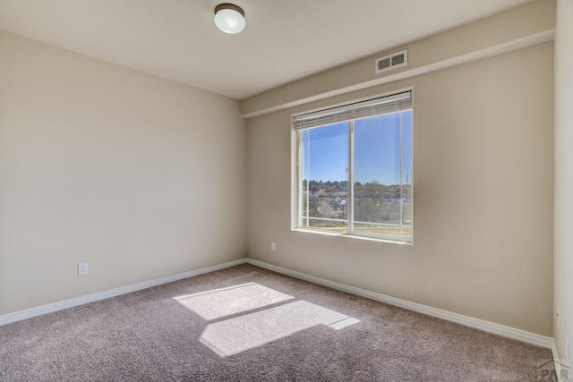 1447 Madison Ridge Hts Unit E, Colorado Springs, CO 80904 - spare room with carpet and baseboards