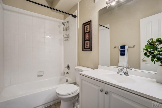 1447 Madison Ridge Hts Unit E, Colorado Springs, CO 80904 - full bathroom featuring vanity, toilet, and shower / tub combination