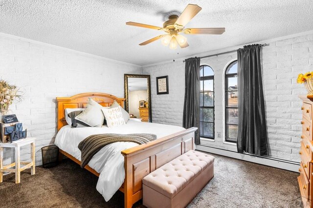 bedroom featuring dark carpet, a textured ceiling, and baseboard heating