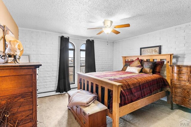 bedroom with light carpet, a textured ceiling, and a ceiling fan