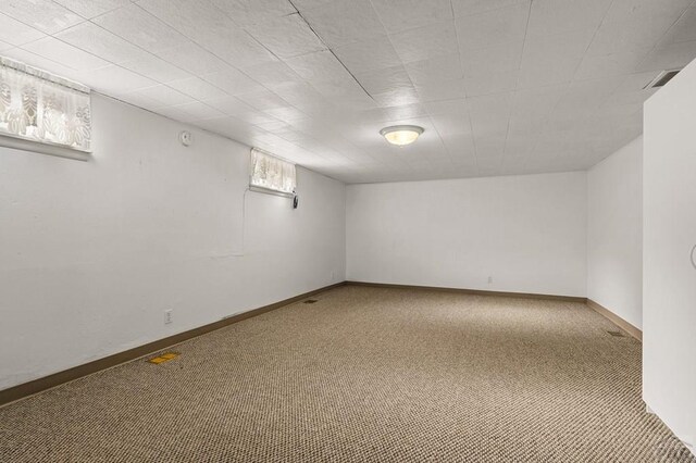 below grade area with carpet floors and baseboards