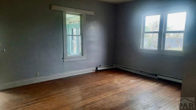205 Tyler St, Walsenburg, CO 81089 - spare room with dark wood finished floors and baseboards