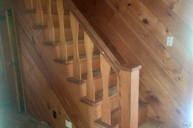 205 Tyler St, Walsenburg, CO 81089 - staircase with wooden walls and lofted ceiling