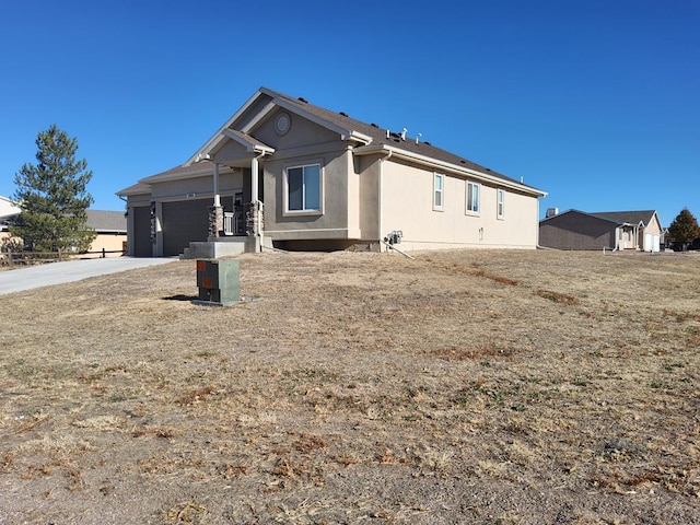 exterior space with driveway and an attached garage