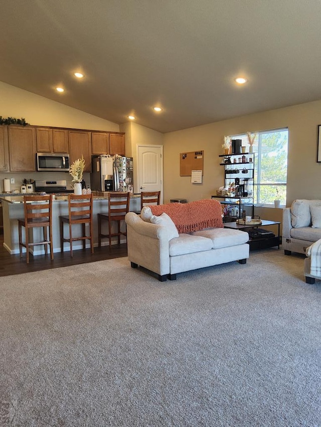 carpeted living room featuring lofted ceiling and recessed lighting