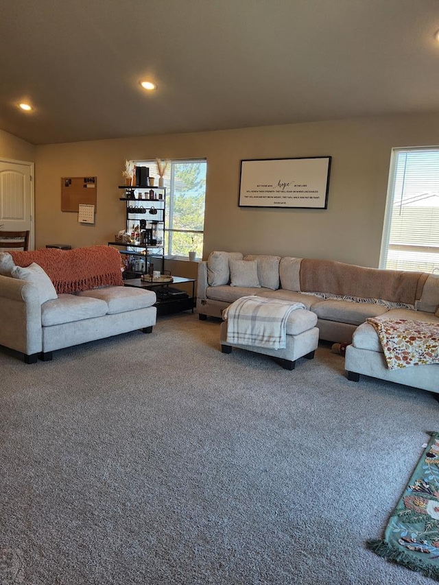 carpeted living area with recessed lighting