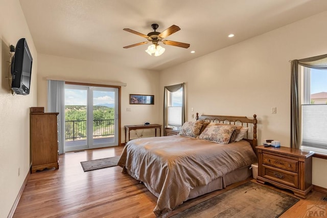 bedroom featuring access to exterior, baseboards, light wood-style floors, and recessed lighting