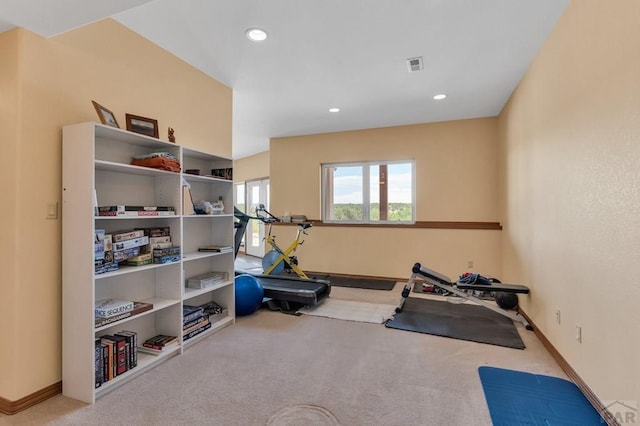 exercise room with baseboards, recessed lighting, visible vents, and light colored carpet