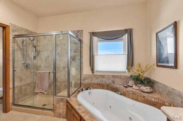 full bathroom featuring a jetted tub, toilet, and a stall shower