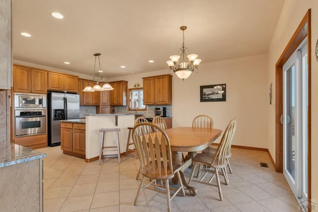 dining space featuring a chandelier, light tile patterned flooring, visible vents, and recessed lighting