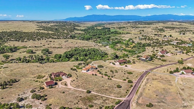 drone / aerial view featuring a mountain view