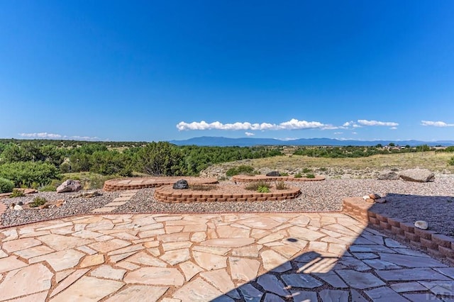 view of patio / terrace with a mountain view