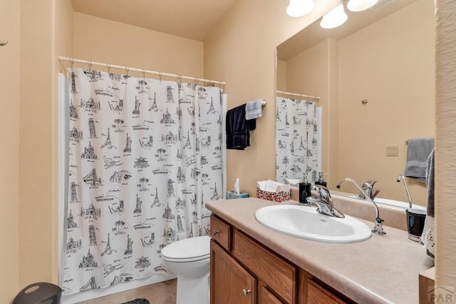 bathroom featuring toilet, tile patterned flooring, a shower with shower curtain, and vanity