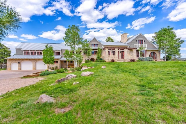 6430 Signal Mountain Rd, Beulah, CO 81023 - view of front of property with concrete driveway, stone siding, a front lawn, an attached garage, and a chimney