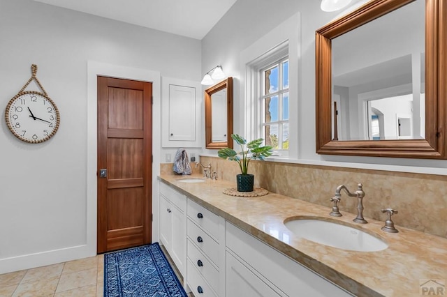 6430 Signal Mountain Rd, Beulah, CO 81023 - bathroom featuring double vanity, baseboards, tile patterned flooring, and decorative backsplash
