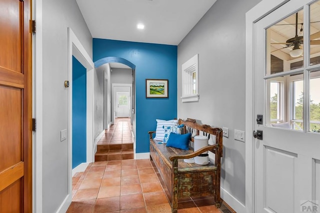 6430 Signal Mountain Rd, Beulah, CO 81023 - entrance foyer featuring arched walkways, ceiling fan, healthy amount of natural light, and light tile patterned floors