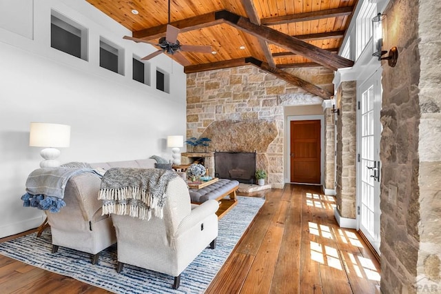 6430 Signal Mountain Rd, Beulah, CO 81023 - living room with wooden ceiling, hardwood / wood-style floors, a stone fireplace, and ceiling fan