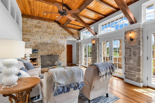 6430 Signal Mountain Rd, Beulah, CO 81023 - living area featuring wooden ceiling with exposed beams, healthy amount of natural light, light wood-type flooring, french doors, and ceiling fan