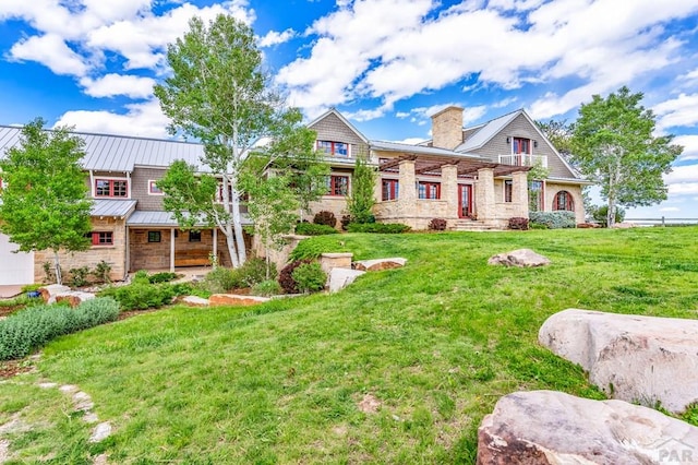 6430 Signal Mountain Rd, Beulah, CO 81023 - view of front facade featuring a chimney, a front lawn, and stone siding