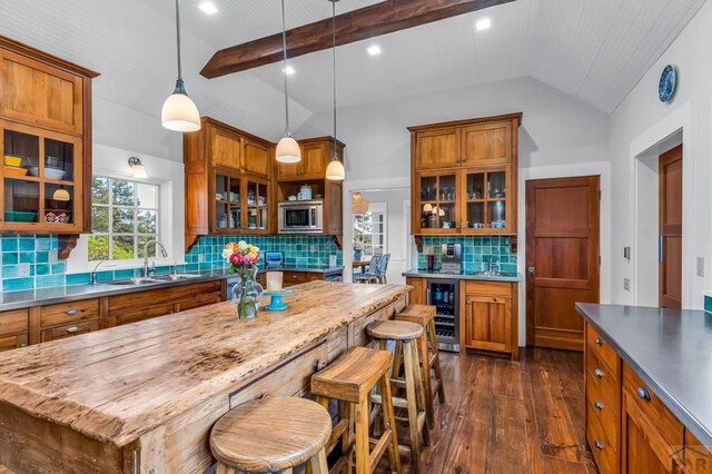 6430 Signal Mountain Rd, Beulah, CO 81023 - kitchen featuring beverage cooler, brown cabinets, dark wood finished floors, and recessed lighting