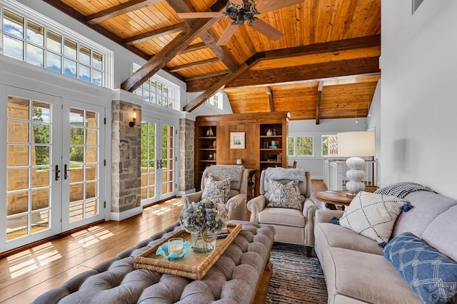 6430 Signal Mountain Rd, Beulah, CO 81023 - living room with french doors, wood ceiling with exposed beams, hardwood / wood-style flooring, healthy amount of natural light, and high vaulted ceiling